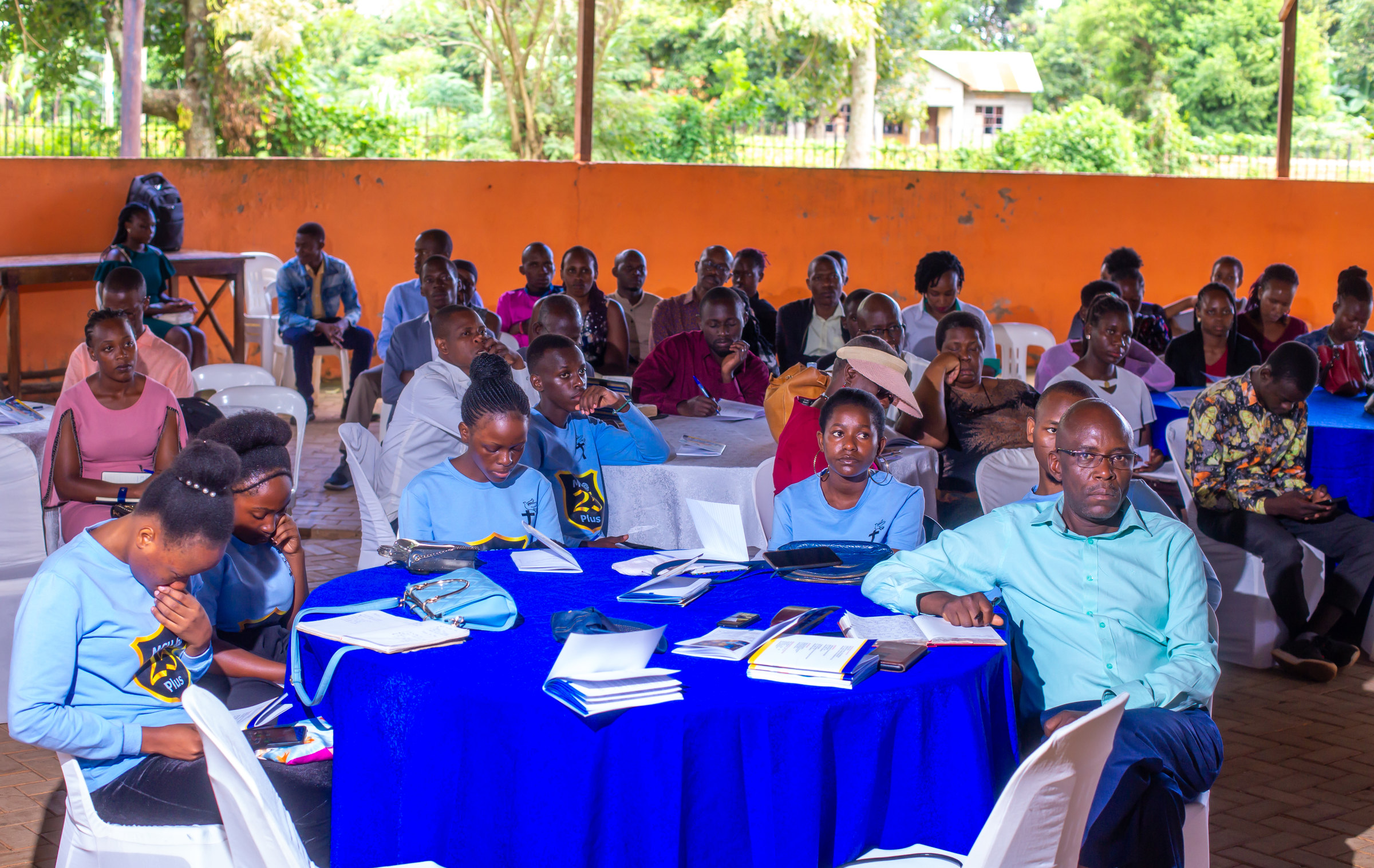 Associates seated at tables during a FOCUS associates' meeting