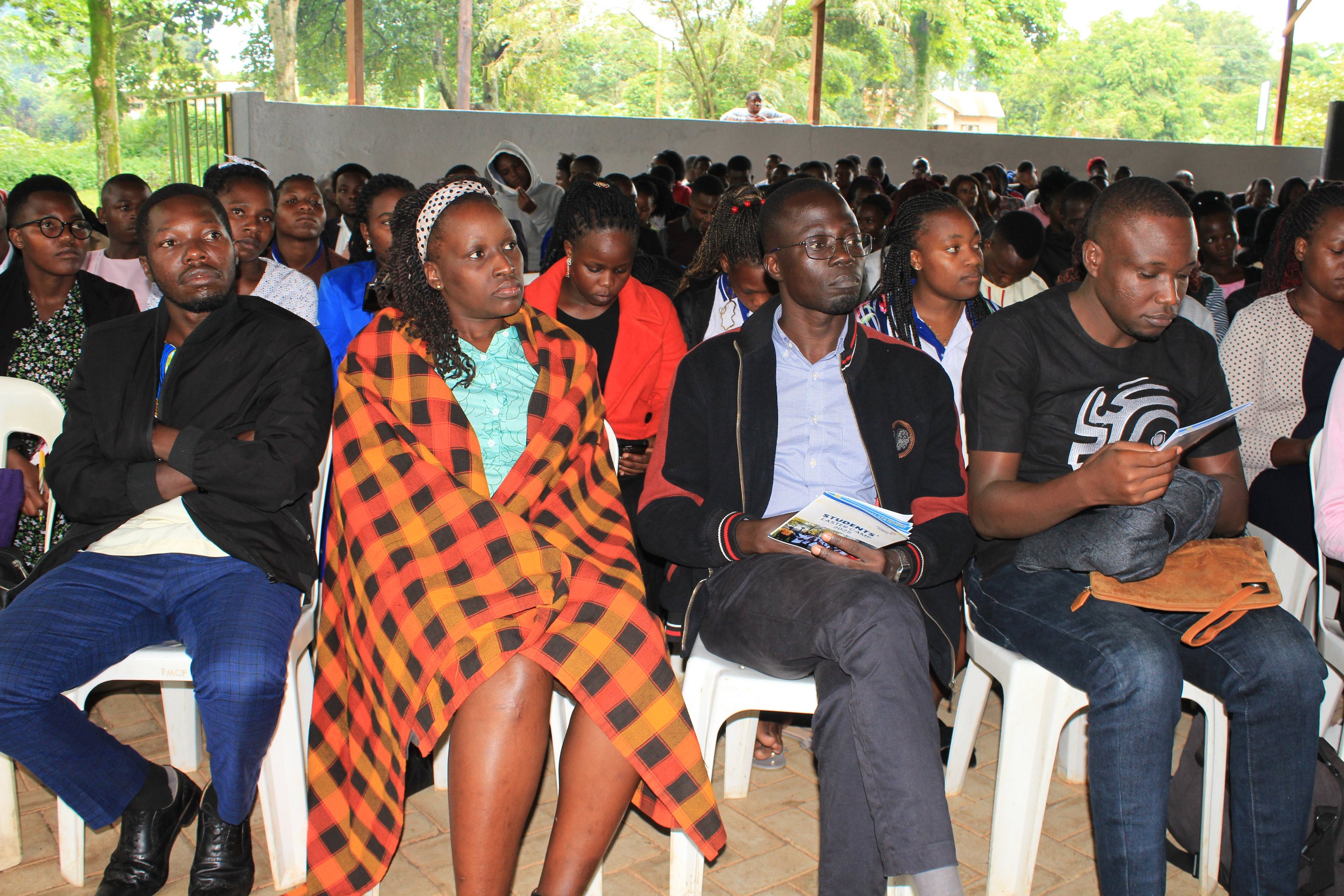 Members of the FOCUS Ministry Committee seated among students at a conference